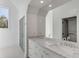 Modern bathroom features a marble countertop vanity, large mirror, glass-enclosed shower, and stylish lighting at 853 Whispering Marsh Dr, Charleston, SC 29412