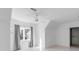 Bright, minimalist bedroom features a ceiling fan, window with gray curtains, and closet at 853 Whispering Marsh Dr, Charleston, SC 29412