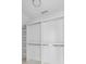 Bright walk-in closet with modern chrome bars, white shelving, and natural light at 853 Whispering Marsh Dr, Charleston, SC 29412