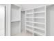 Bright, walk-in closet with white shelving and ample storage space for organizing clothes and accessories at 853 Whispering Marsh Dr, Charleston, SC 29412