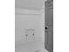 A well-lit closet with an access panel, coat rod, and a gray door with a black handle at 853 Whispering Marsh Dr, Charleston, SC 29412