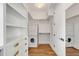 A closet fitted with shelving, drawers and hanging racks with the bonus of a washer and dryer at 853 Whispering Marsh Dr, Charleston, SC 29412