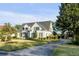 Charming two-story home with a well-manicured lawn and inviting curb appeal at 853 Whispering Marsh Dr, Charleston, SC 29412