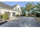 Spacious driveway leading to a two-car garage with modern glass doors at 853 Whispering Marsh Dr, Charleston, SC 29412