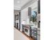 Close-up of a modern kitchen with stainless steel appliances, custom cabinets, and a large window above the stove at 853 Whispering Marsh Dr, Charleston, SC 29412