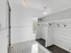 Bright mud room features storage bench, hooks, shiplap, and patterned tile flooring at 853 Whispering Marsh Dr, Charleston, SC 29412