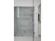 Modern shower with marble tiling, glass door, and a built-in shelf for toiletries at 853 Whispering Marsh Dr, Charleston, SC 29412