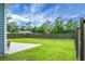 Expansive fenced backyard with a concrete patio, perfect for outdoor enjoyment at 8703 Jenny Lind St, North Charleston, SC 29406