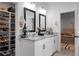Bright bathroom features double sink vanity with granite countertops, modern fixtures, and walk-in closet at 8703 Jenny Lind St, North Charleston, SC 29406