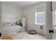 Bright bedroom features a comfortable bed, stylish rug, window, and decorative accents for a cozy feel at 8703 Jenny Lind St, North Charleston, SC 29406