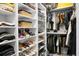 Custom closet with built-in shelving, shoe racks, and hanging rods provides ample storage space at 8703 Jenny Lind St, North Charleston, SC 29406