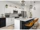 Open concept kitchen with stainless steel appliances, granite countertops, and modern finishes at 8703 Jenny Lind St, North Charleston, SC 29406