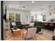 Open-concept living room features large windows, recessed lighting, and a neutral color palette at 8703 Jenny Lind St, North Charleston, SC 29406