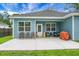 Cozy backyard patio with a white door, offering a comfortable outdoor space at 8703 Jenny Lind St, North Charleston, SC 29406