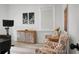 Cozy sitting area with floral armchairs, decorative artwork, and natural light at 8703 Jenny Lind St, North Charleston, SC 29406