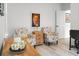 Comfortable seating area with patterned armchairs, a wooden side table, and natural light at 8703 Jenny Lind St, North Charleston, SC 29406