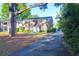 Brick townhome with mature trees and front door, complemented by a paved driveway at 926 Lansing Dr # 926-G, Mount Pleasant, SC 29464