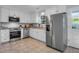 Modern kitchen boasts stainless steel appliances, ample white cabinetry, and granite countertops for a sleek design at 926 Lansing Dr # 926-G, Mount Pleasant, SC 29464