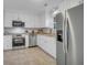 Modern kitchen boasts stainless steel appliances, ample white cabinetry, and granite countertops for a sleek design at 926 Lansing Dr # 926-G, Mount Pleasant, SC 29464