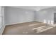 Bright living room featuring neutral walls, ceiling fan, and plush carpeting, creating a warm and inviting atmosphere at 926 Lansing Dr # 926-G, Mount Pleasant, SC 29464