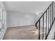 Sunlit living room featuring plush carpeting and staircase at 926 Lansing Dr # 926-G, Mount Pleasant, SC 29464