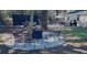 Spacious backyard with outdoor seating area, landscaping, and mature trees at 960 Savage Road Rd, Charleston, SC 29414
