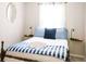 Cozy bedroom featuring a bed with blue and white bedding, bedside lamps, and a serene atmosphere at 960 Savage Road Rd, Charleston, SC 29414