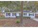 Charming single-story home with mature trees and a well-maintained front yard at 960 Savage Road Rd, Charleston, SC 29414