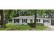 Charming single-story home with freshly painted white brick and classic black shutters, offering curb appeal and inviting style at 960 Savage Road Rd, Charleston, SC 29414