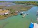 Attractive aerial view highlights a waterway, boat ramp, and surrounding marshland at 968 Cummings Cir, Mount Pleasant, SC 29464