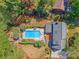 Aerial view showcasing a private backyard with a sparkling swimming pool, lounge chairs, and a wooden deck at 968 Cummings Cir, Mount Pleasant, SC 29464