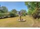 Picturesque backyard with a classic water fountain, lush greenery, and ample space for outdoor activities and relaxation at 968 Cummings Cir, Mount Pleasant, SC 29464