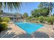 Expansive in-ground pool surrounded by lush landscaping and mature trees, offering a private outdoor oasis at 968 Cummings Cir, Mount Pleasant, SC 29464