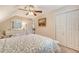 Well-lit bedroom features a ceiling fan, a dresser with a mirror, and a comfortable bed at 968 Cummings Cir, Mount Pleasant, SC 29464