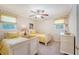 Bright bedroom is furnished with twin beds, a ceiling fan, and sunny yellow accents at 968 Cummings Cir, Mount Pleasant, SC 29464
