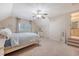 Large bedroom with ceiling fan boasts a king-size bed and serene window views at 968 Cummings Cir, Mount Pleasant, SC 29464