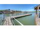 Picturesque dock view showcasing a walkway, boats, and waterfront buildings, ideal for leisurely strolls and sightseeing at 968 Cummings Cir, Mount Pleasant, SC 29464