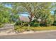 Well-maintained home featuring a lush lawn, mature trees, and a long driveway leading to a welcoming residence at 968 Cummings Cir, Mount Pleasant, SC 29464
