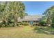 Charming single-story home featuring a lush front lawn and double blue front doors, offering curb appeal and a welcoming entrance at 968 Cummings Cir, Mount Pleasant, SC 29464