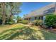 Charming home with lush landscaping, featuring a brick exterior and inviting blue double doors at 968 Cummings Cir, Mount Pleasant, SC 29464