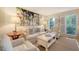 Comfortable living room with bright artwork, plush seating, and large windows providing natural light at 968 Cummings Cir, Mount Pleasant, SC 29464