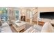 Cozy living room with wood floors, white trim, and plush seating. Stairway in background at 968 Cummings Cir, Mount Pleasant, SC 29464
