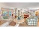 Open-concept living room with fireplace, comfortable seating, and partial view of staircase and kitchen at 968 Cummings Cir, Mount Pleasant, SC 29464