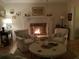 Warm living room featuring a white brick fireplace with mantel decor at 968 Cummings Cir, Mount Pleasant, SC 29464