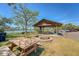 Outdoor picnic area with a fire pit, several picnic tables, and a playground in a relaxing waterfront setting at 968 Cummings Cir, Mount Pleasant, SC 29464