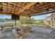 Covered outdoor recreation space featuring picnic tables, a TV, ceiling fans, cornhole boards, and a playground at 968 Cummings Cir, Mount Pleasant, SC 29464