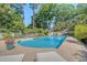 Large in-ground pool with clean water is situated within a fenced backyard, perfect for summer days at 968 Cummings Cir, Mount Pleasant, SC 29464