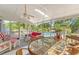 Relaxing porch features dining area, wicker furniture, and a view of the pool at 968 Cummings Cir, Mount Pleasant, SC 29464