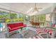 Inviting porch features comfortable wicker seating, a ceiling fan, and views of the pool at 968 Cummings Cir, Mount Pleasant, SC 29464