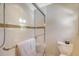 Tiled shower features glass door, showerhead, built-in seat, and decorative tile accent at 968 Cummings Cir, Mount Pleasant, SC 29464